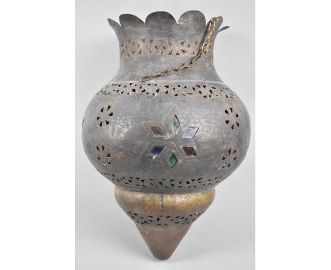 A North African Pierced Brass Ovoid Light Shade with Coloured Glass Inserts and Crown Top, 47cm high 