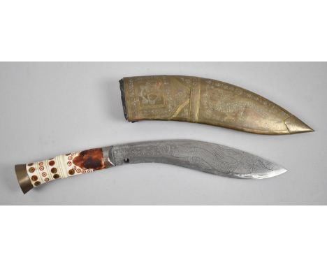 A Souvenir Kukri Knife with Brass Mounted Scabbard, Engraved Blade and Ivorine Handle, Missing Two Small Daggers 