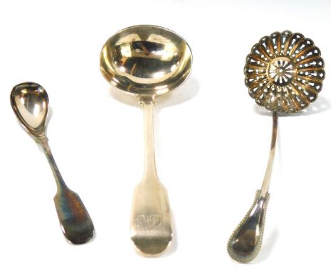 Three Georgian and later spoons, comprising a Georgian toddy ladle, hallmarks rubbed, a Victorian serving ladle, Fiddle patte