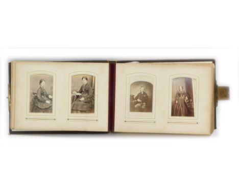 A late Victorian/Edwardian embossed leather photograph album, including an extensive selection of portrait photographs of the