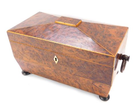 A Victorian burr walnut tea caddy, with a domed top, and mother of pearl keyhole, with swing handles, on bun feet, 19cm high,