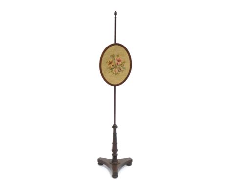 A Victorian pole screen, with oval banner with floral tapestry inlay, on tripod base, 150cm high, 36cm wide.