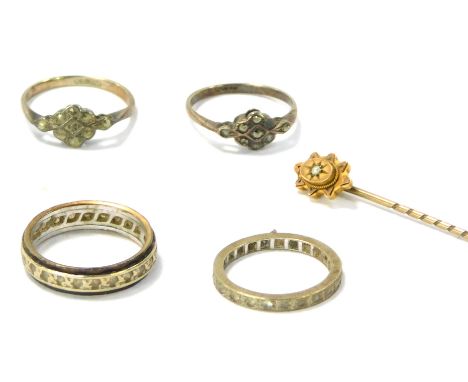 A group of jewellery, comprising a 9ct gold and seed pearl topped stick pin, a silver eternity ring, a silver and two marcasi