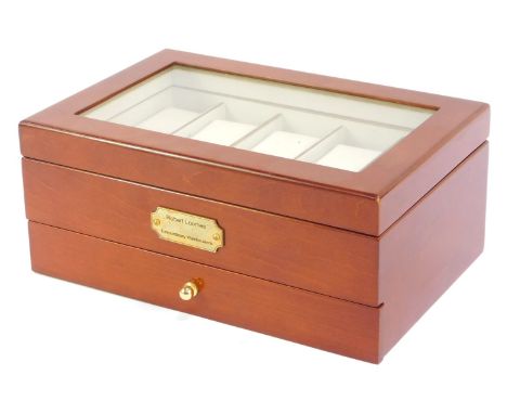 A watch display case, in a walnut finish with inserts for ten wristwatches and a pull out drawer, with applied plaque, 12cm h