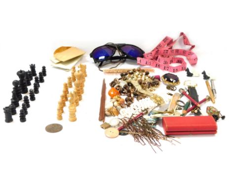 A metal money tin, and contents of gold plated gate bracelet, sunglasses, chess pieces, brooches, etc. (AF)