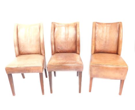 A set of three leatherette dining chairs, upholstered in light brown. (AF)
