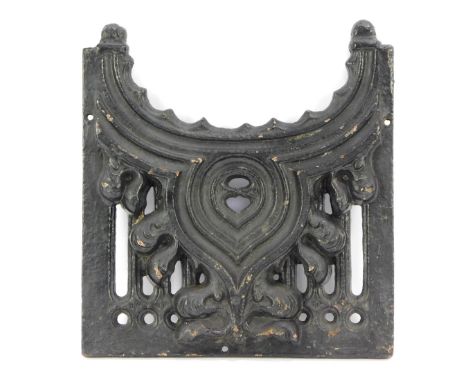 A cast iron part fire grate, with scroll and fleur de lis panel, 31cm x 28cm.