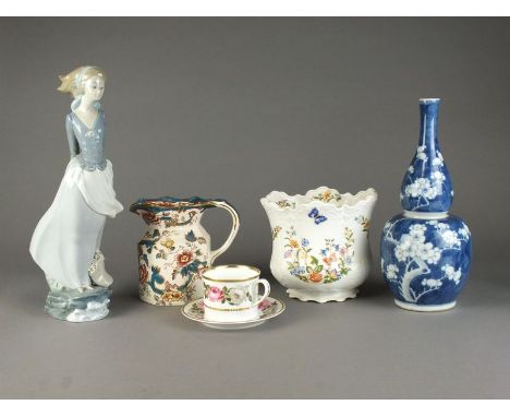 A mixed group of ceramics to contain a Lladro porcelain figure of a girl with windswept hair stood upon a rock, 37cm high, fu
