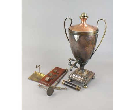 An early 19th century plated copper two handled tea urn in classical style on square reeded base and four squat feet, brass s