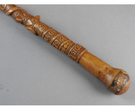 A Welsh folk art walking stick carved on a sash 'God is Love' made 1925 Duw Cariad Yw carved with further mottos, stars, swas