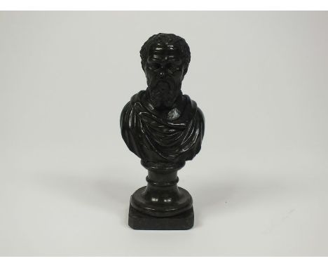 A verde antico portrait bust of Michaelangelo on turned socle and canted plinth, 23cm high