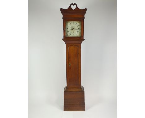 A George III oak 30 hour longcase clock, the square hood with heart shaped pediment enclosing a 12 inch white painted dial wi