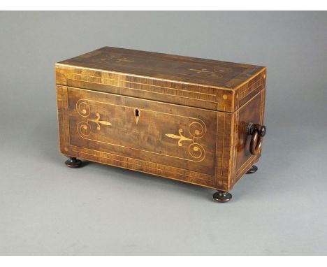 An early 19th century crossbanded mahogany and inlaid tea caddy, the rectangular top enclosing two lidded two boxes and a lat