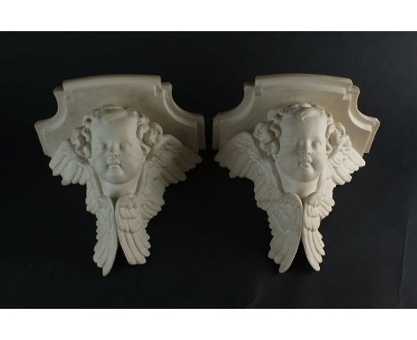 A pair of Royal Worcester parian wall brackets in the form of winged putto, late 19th century, impressed marks,23.5cm wide an