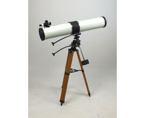 A 4.5 inch reflector telescope and spare lenses in original box