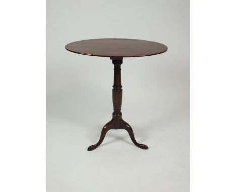 A mahogany tripod table, 19th century, altered the oval figured top on a turned pilaster column and three down curved taperin