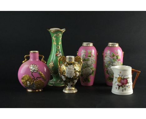 A pair of Coalport pink ground vases, painted busily with foliage, 17.5cm high (damage to one upper rim), a Coalport pink gro