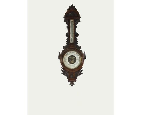 A Victorian carved oak aneroid barometer with cased thermometer and 8 inch white dial, with open centre revealing the movemen