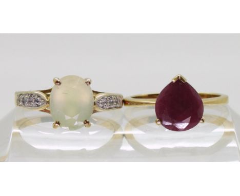 A 9ct gold opaque ruby ring, finger size N1/2, together with a 9ct gold prehnite and&nbsp; clear gem ring size N1/2, weight t