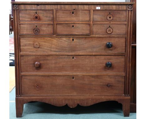 A Victorian mahogany Scotch style chest with two short drawers flanked by deep drawers over three long drawers on bracket fee
