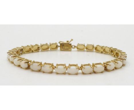 A 9ct gold white opal bracelet, length 18.5cm, weight 11.6gms Condition Report:Available upon request