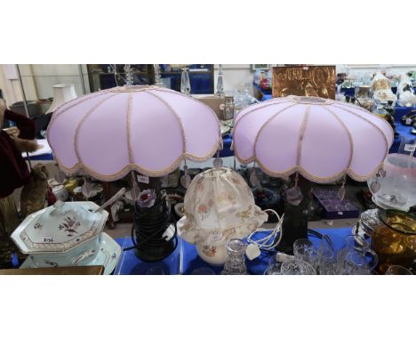 A pair of amethyst glass table lamps, with painted decoration and fancy shades, together with a Bunnykins table lamp and an A