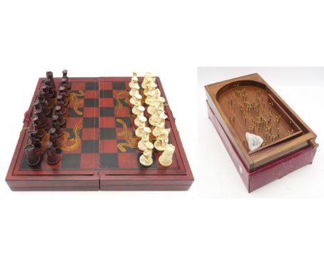 A Chinese resin chess set, together with a Past Times tabletop bagatelle board Condition Report:Available upon request