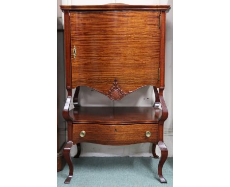 A 20th century mahogany serpentine front side cabinet with single door over open shelf over single drawer on cabriole support