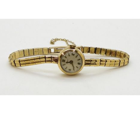 A 9ct gold ladies Tissot watch with integral strap, diameter of the case 16.8mm,&nbsp; weight 16gms Condition Report:Availabl