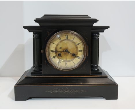 A ebonised wood mantle clock, in the style of a slate clock Condition Report:Available upon request