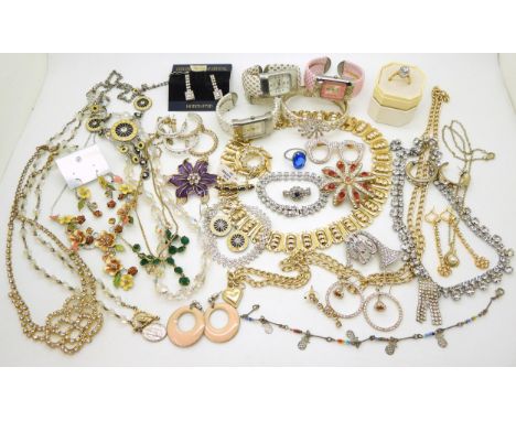 a collection of vintage costume jewellery to include a diamante french horn, vintage diamante, and a plique a jour style flow