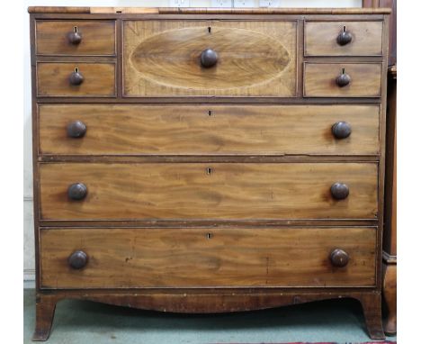 A Victorian Scotch style chest with large central drawer flanked by single deep drawer to left and two short drawers to right