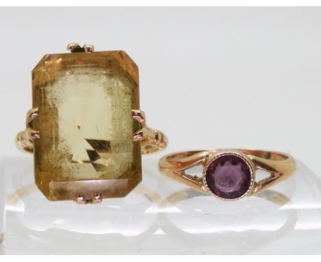 A 9ct gold large citrine ring, citrine approx 18mm x 13mm, finger size P1/2, and a 9ct purple gem ring size K, weight togethe