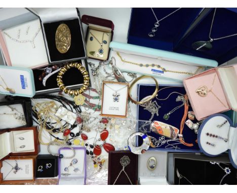 A very large collection of costume and silver jewellery to include an amethyst brooch by Kit Heath, a knotwork pendant, mothe