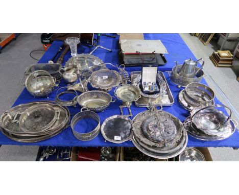 A collection of EPNS including serving trays, a mirror in the shape of a fan, swing handled baskets, toast racks,&nbsp; an&nb