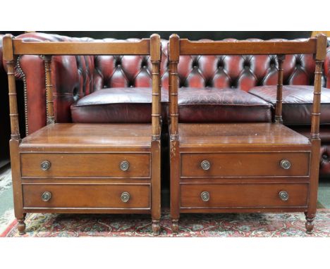 A pair of early 20th century mahogany bedside tables with galleried tops over open shelf with turned uprights over two drawer