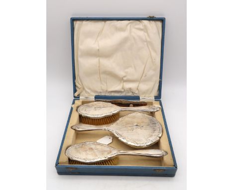 A cased four piece silver dressing set,&nbsp;William Vale &amp; Sons, Chester 1923, comprising two hair brushes, a hand mirro