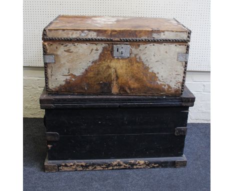 A small metal trunk, a skin covered 19th century trunk and an iron bound trunk