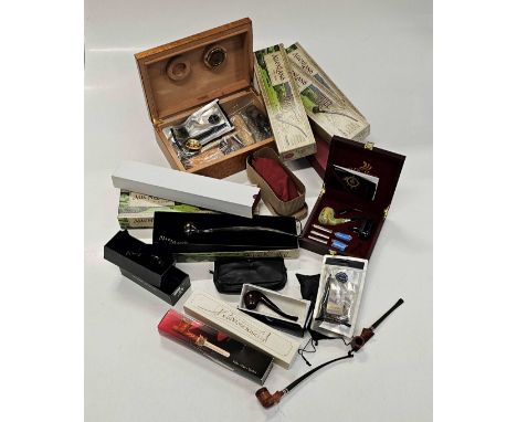 A large collection of pipe smoking items and associated accessories including five cased Tolkein Lord of the Rings pipes, mos