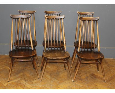 A set of six Ercol yoke and stick back dining chairs
