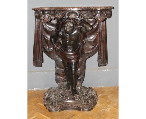 A well carved late 19th century Blackamore console table with serpentine top and drapery, raised on a plinth base, 110 x 82cm