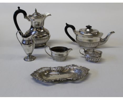 HS, a Victorian silver batchelor's teapot of demi reeded form, London 1890, a conforming cream, London 1891, a matched coffee