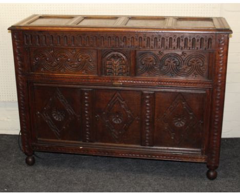 A Garrard model 301 turntable and an Acoustical Manufacturing Company amplifier, housed in a Jacobean style oak panelled cabi