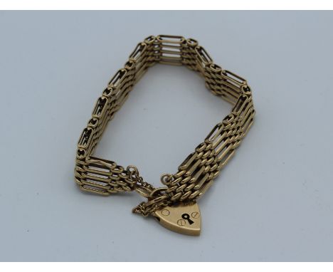 9ct yellow gold 5 bar gate bracelet with padlock and safety chain. 16cm approximately. 17.9gm