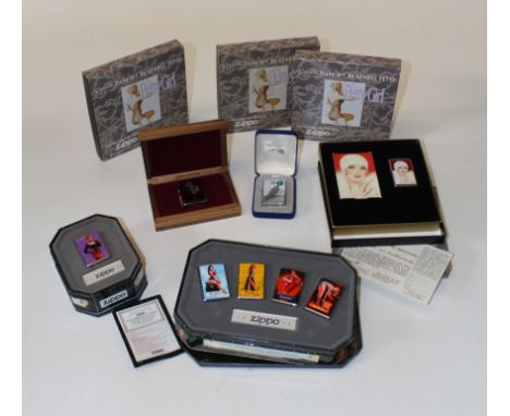 A set of six George Petty Pin Up Girl zippo lighters, boxed, another set of four similar Zippo lighters in matching tin box, 