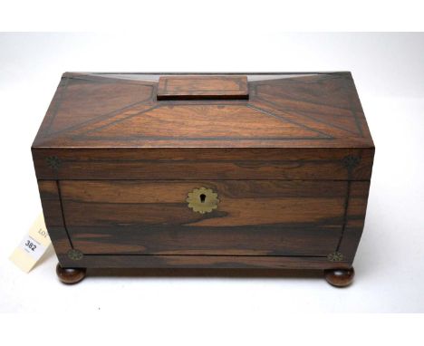 A Victorian brass bound rosewood sarcophagus tea caddy, the interior with central recess fitted with glass bowl liner, flanke