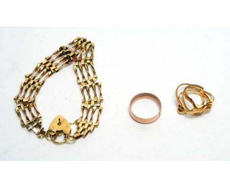 A 9ct yellow gold gate link bracelet; a 9ct gold wedding band; and a 9ct yellow gold puzzle ring, 16.3g gross. 