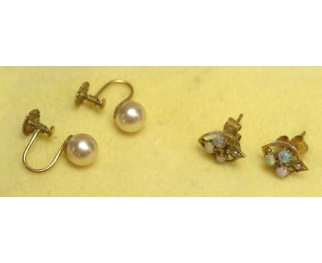 A pair of Mikimoto cultured pearl earrings, in 9ct yellow gold screw mounts, boxed; and a pair of opal earrings. 