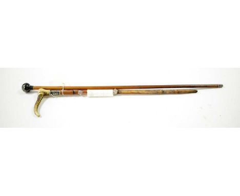 A silver topped swagger stick, 67cms high; together with a horn handled riding crop, with silver collar. (2)