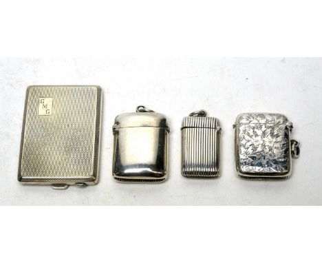 A silver match book case, with engine turned design; and three silver vesta cases. 